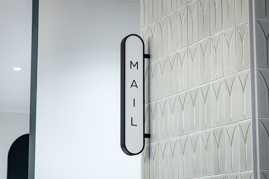 A white blade sign that says 