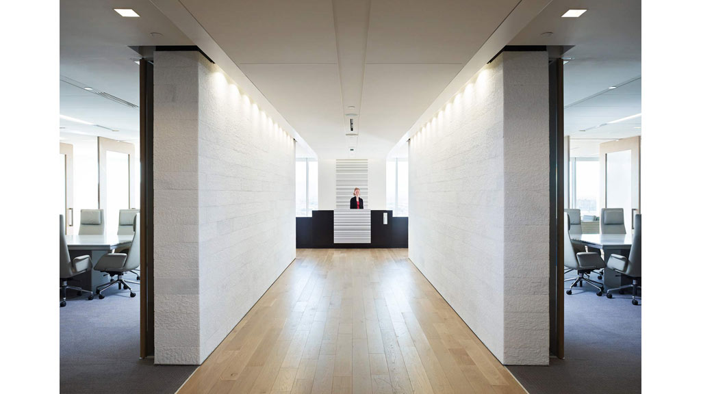 A room with a wood floor and white walls.
