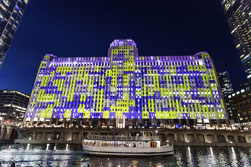 Art on the Mart nighttime view from Chicago river