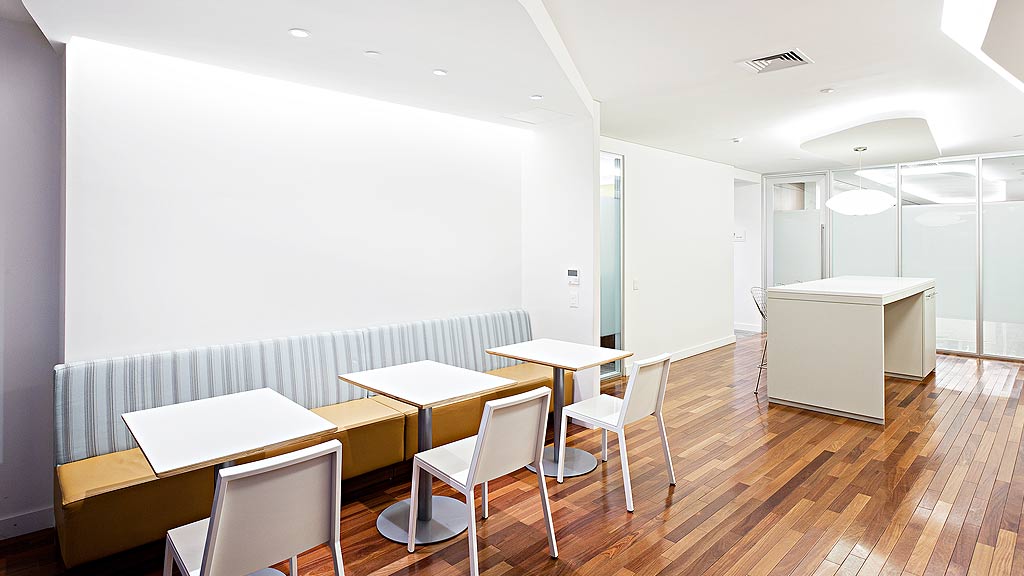 A room with tables and chairs.