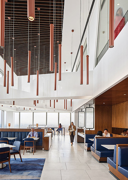 A room with people and chairs.