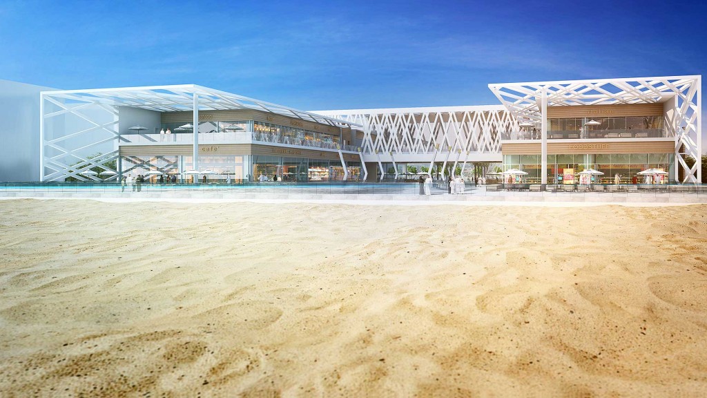 A building with a beach in front.