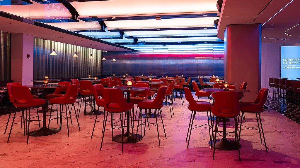 A room with tables and chairs.