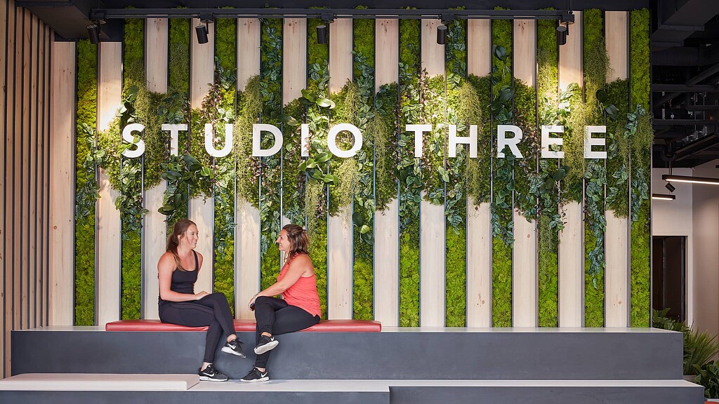 Two women sitting on a bench.