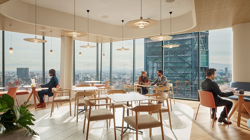 A group of people sitting at tables.