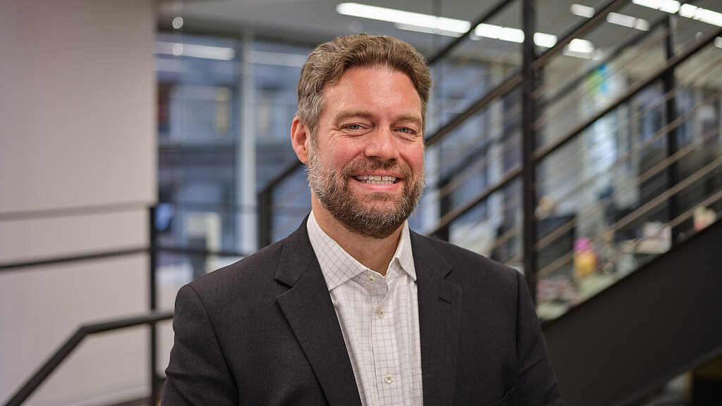 A man smiling for the camera.