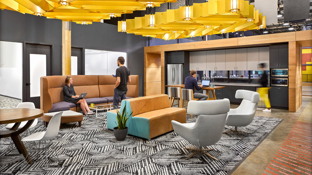 A few people sitting in a room.