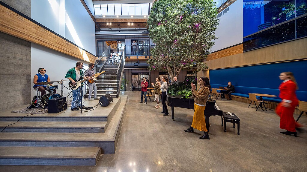 A band performing in the atrium at Universal Music Publishing Group.