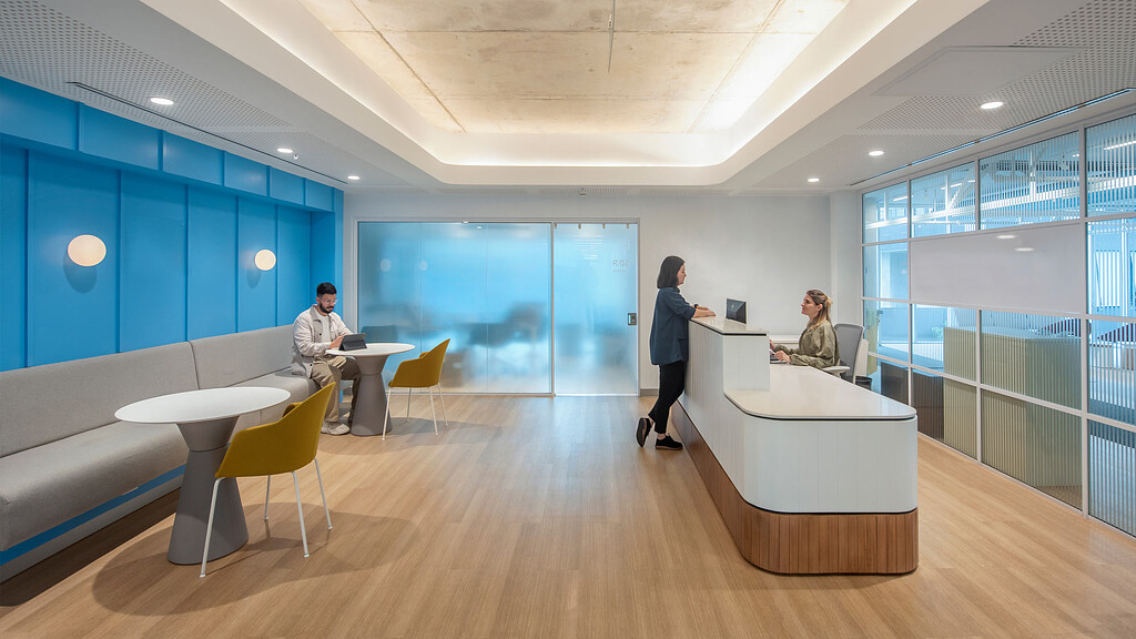 A woman and a man in an office.