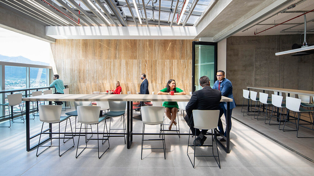 Employees sitting at terrace table at Torre Judicial