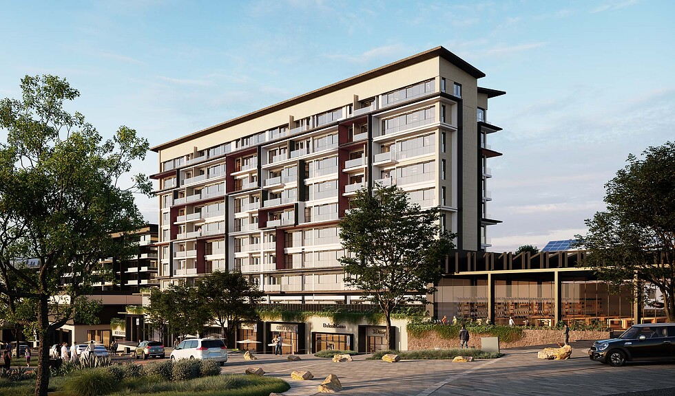 A building with trees and cars in front of it.