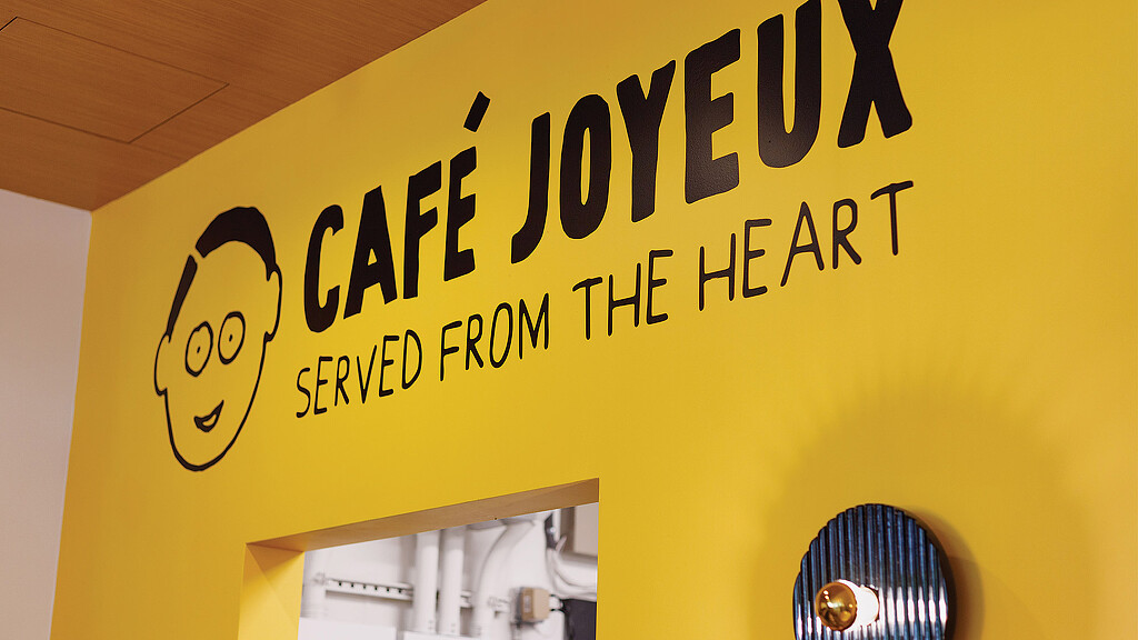 A yellow wall with black text.