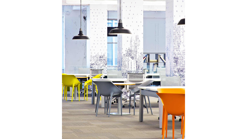 A room with tables and chairs.