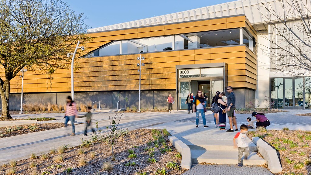 A group of people outside a building.