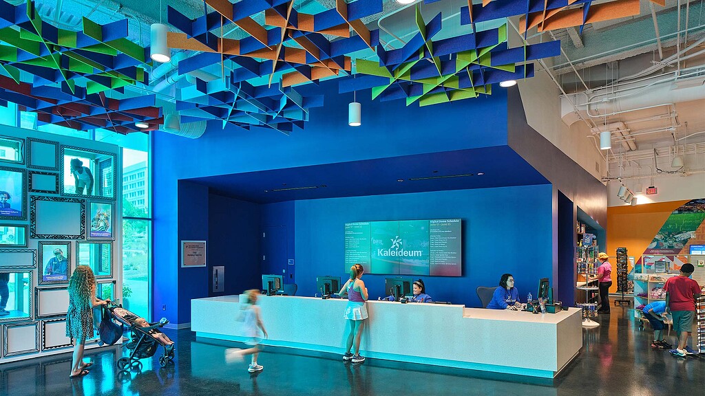 People in a room with a screen.