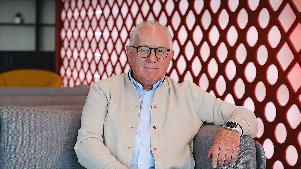 A man sitting on a couch.