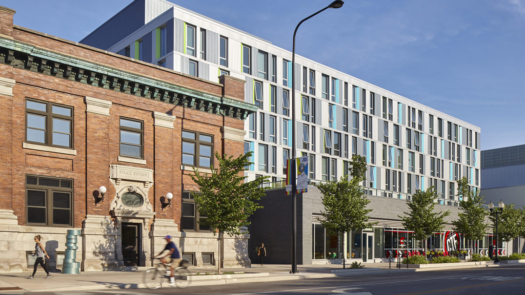 A building with a street and trees.