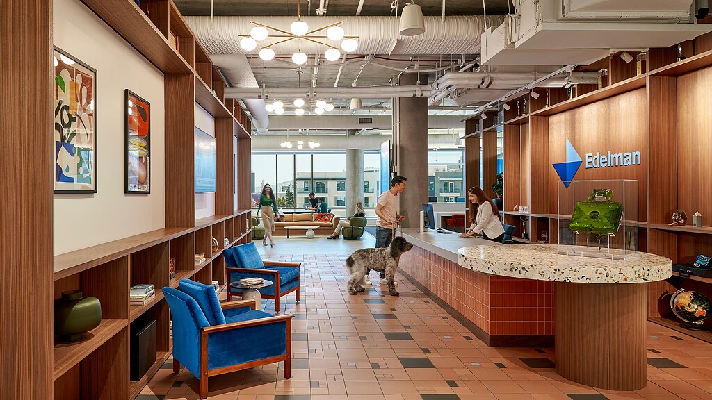 Interior photo of people interacting in a lobby