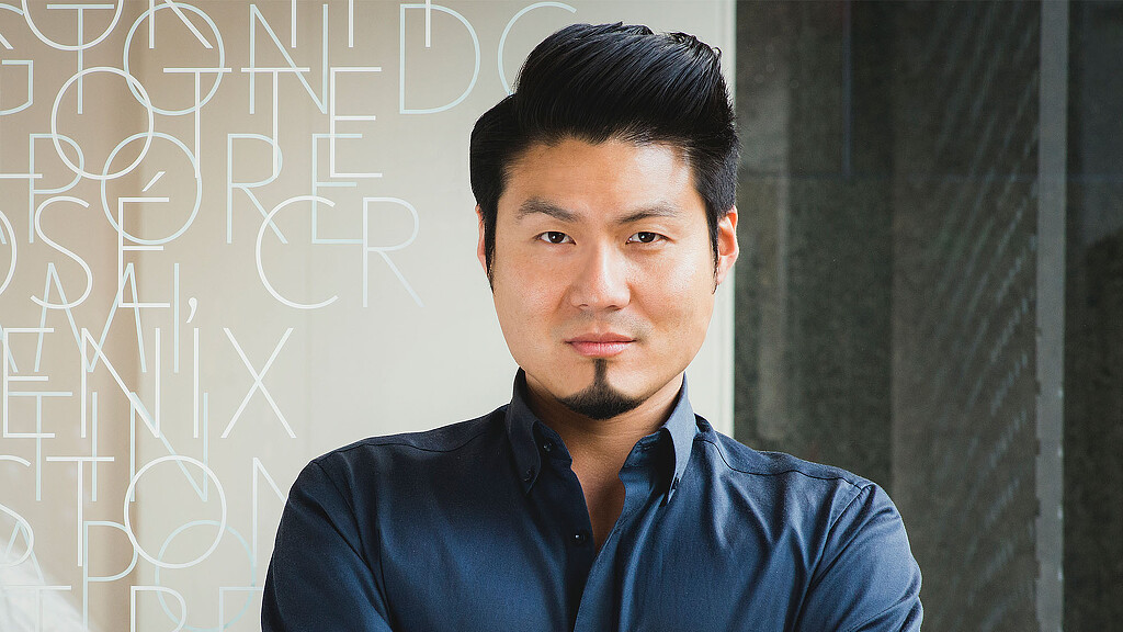 A man in a blue shirt.