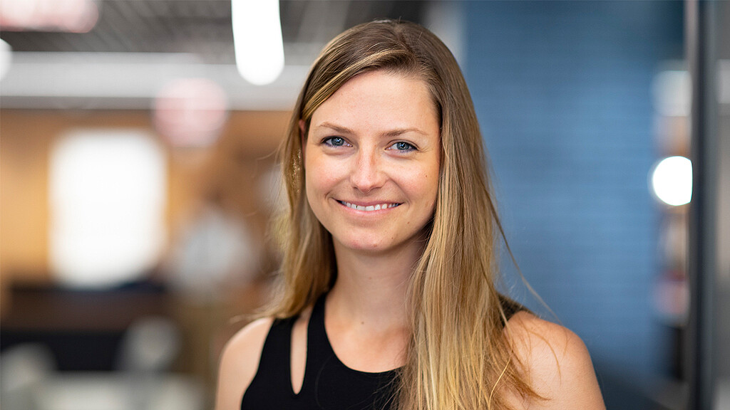 A woman smiling at the camera.