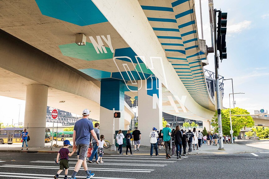 Seattle Mariners fan walking under highway underpass