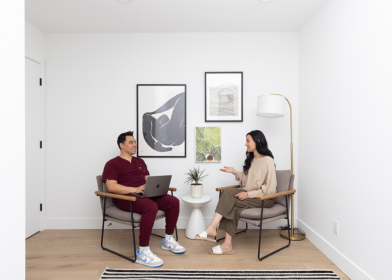 Doctor and patient conversing at Open Wellness