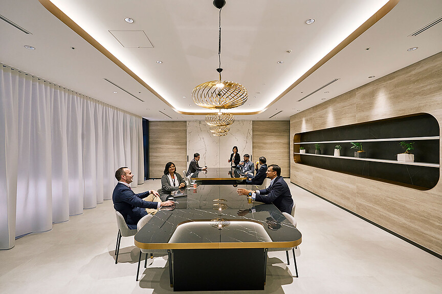 A group of people sitting around a table.