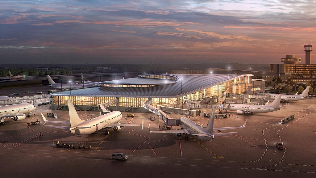 A group of airplanes at an airport.