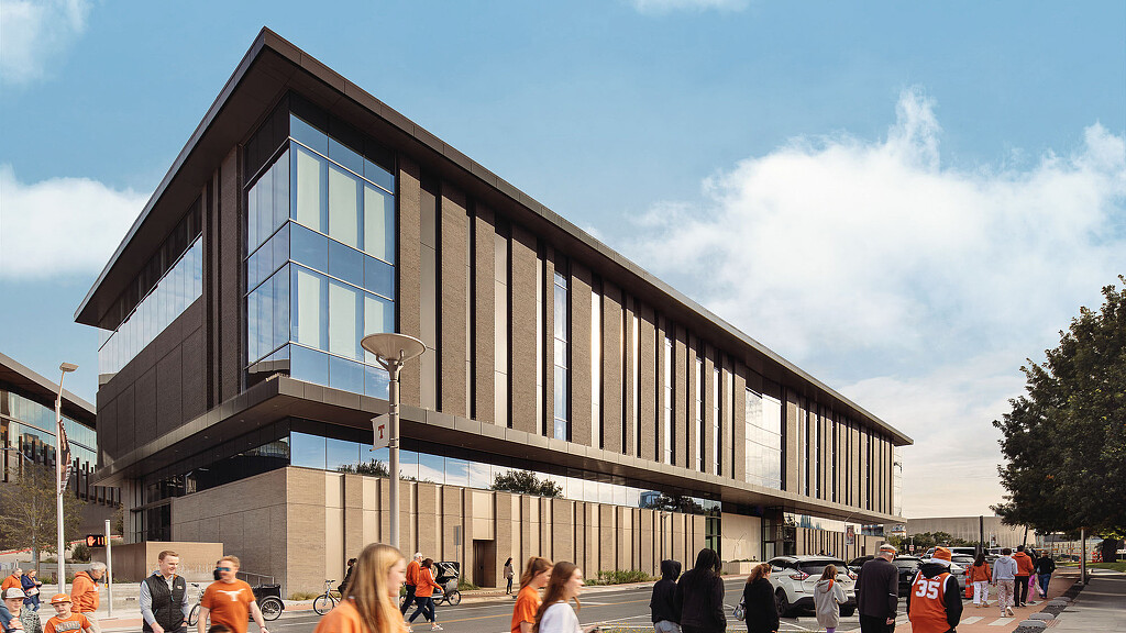 A group of people outside of a training facility.