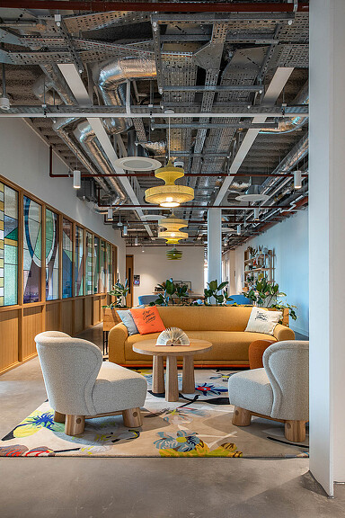 A room with a couch and chairs at Etsy Dublin