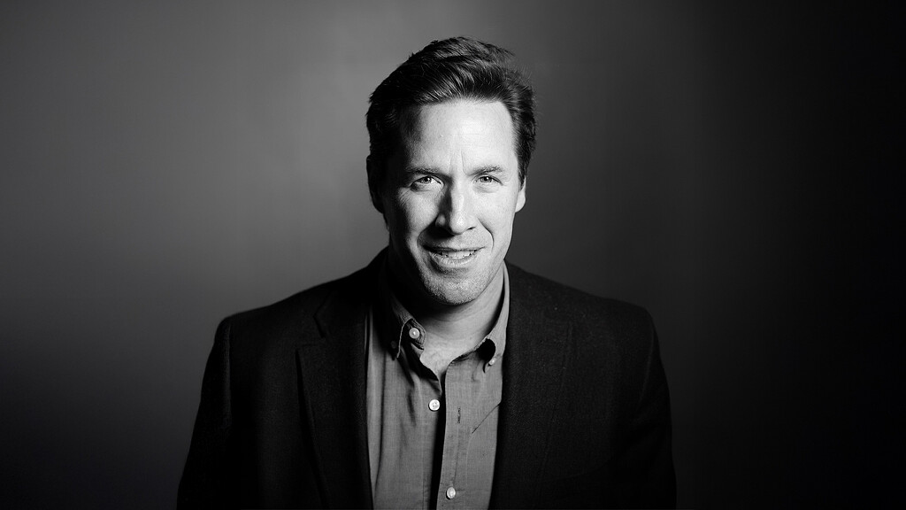 A man smiling for the camera.