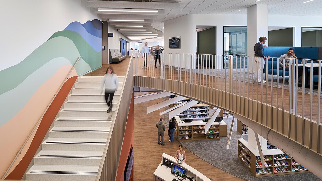 People walking up a staircase.