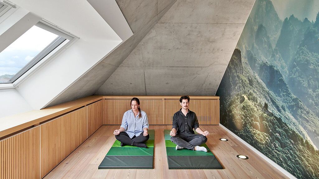 Two men sitting on green stairs.