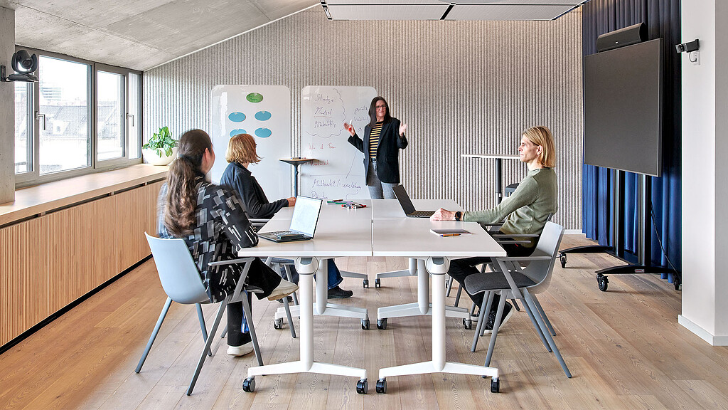 A group of people sitting around a table.