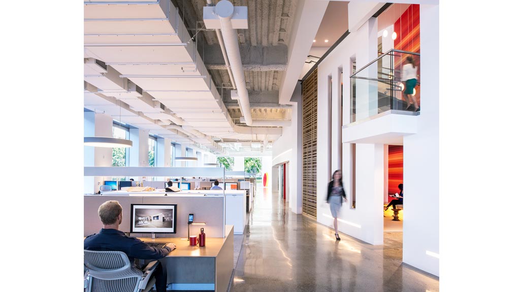 A person walking in an office.