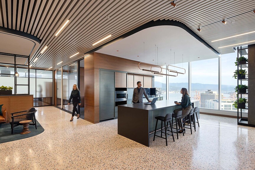 A few people in a large room.