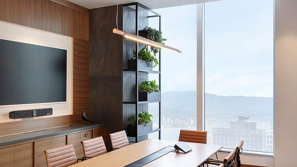 A conference room with a large screen.