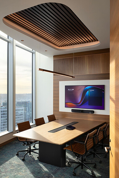 A conference room with a large screen.