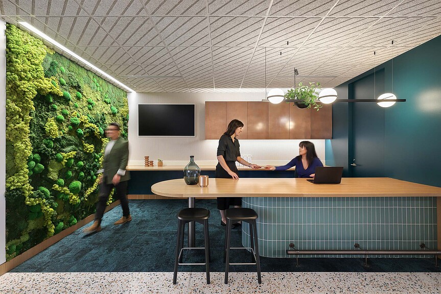 A group of people sitting at a bar.