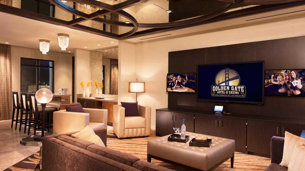 A living room with a large television.