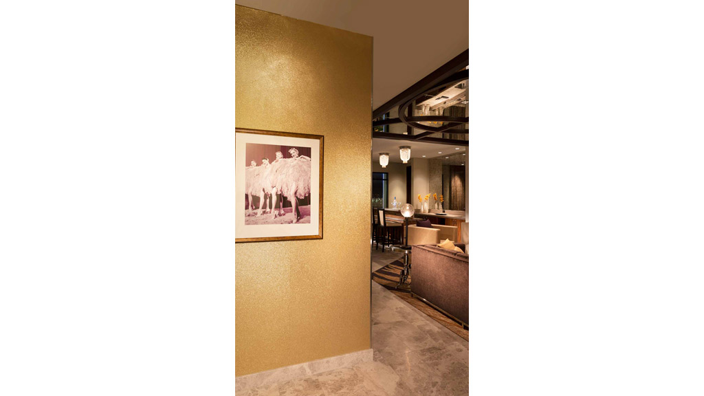 A room with a painting on the wall.