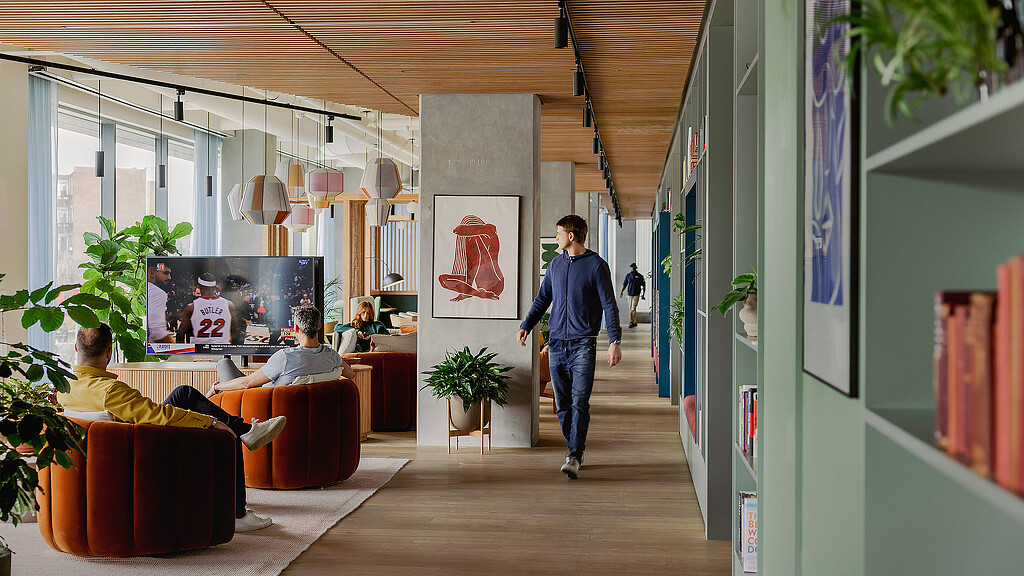 A person walking in a room.