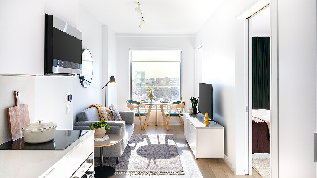 A room with a table and chairs.