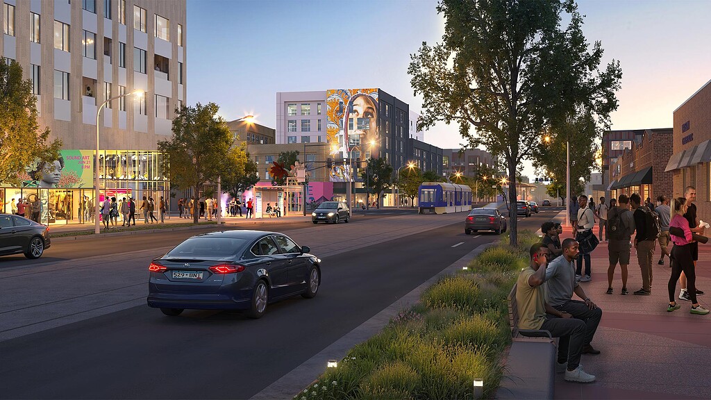 A busy street with cars and people.