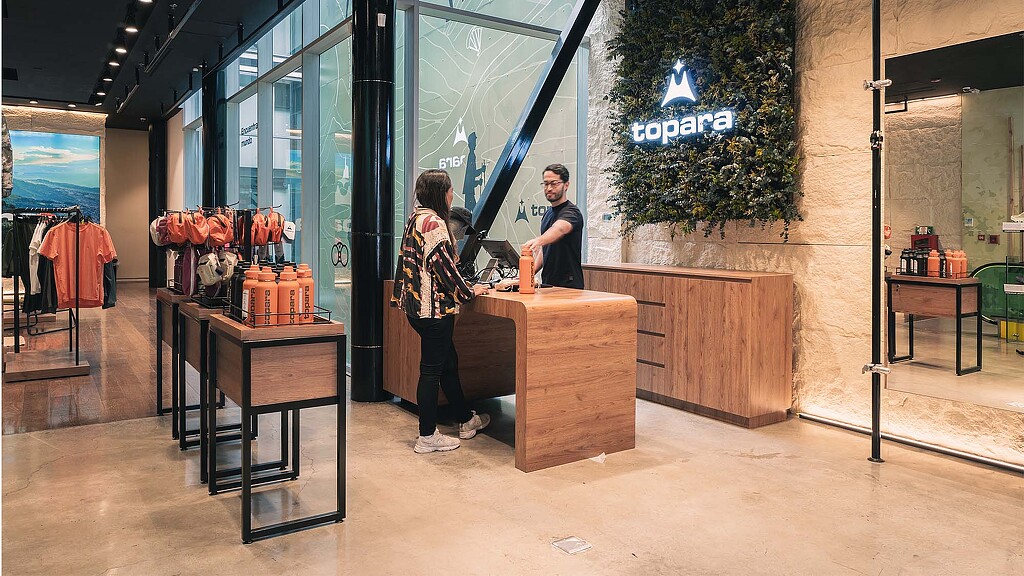 A man and woman standing in a store.