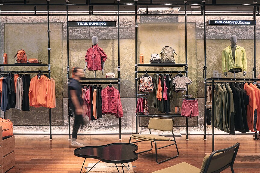 A person looking at a personnequin in a store.