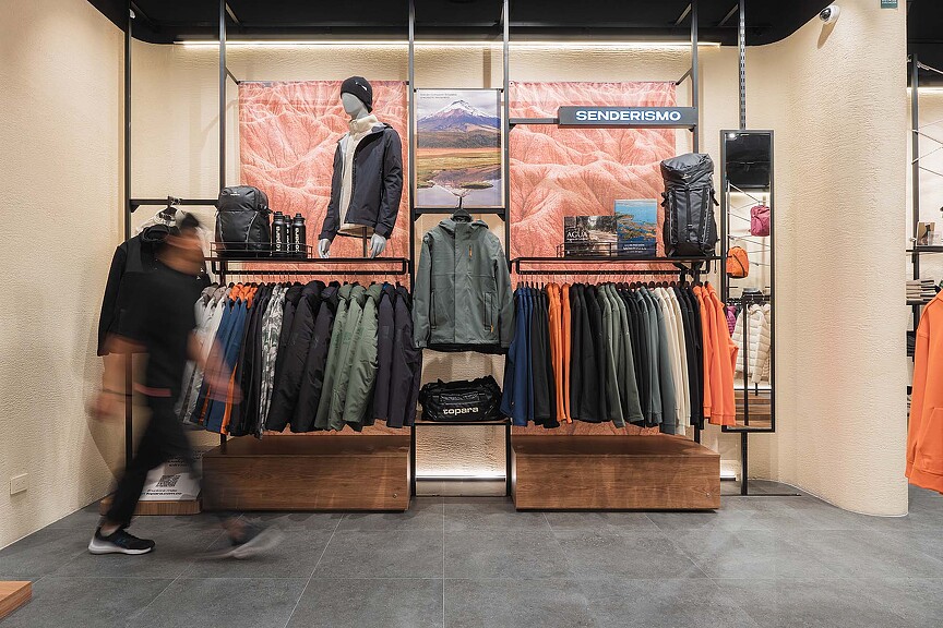 A person looking at a display of clothing.