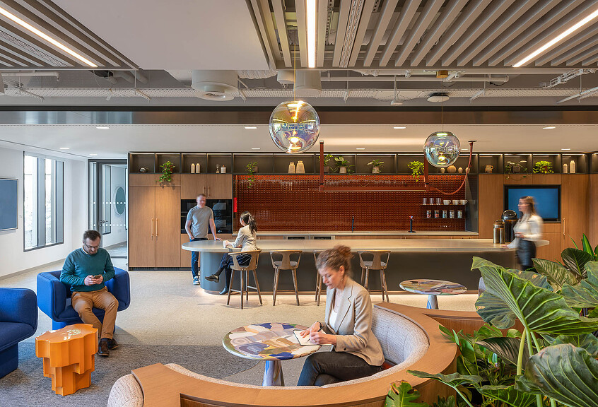 Financial services workplace interior with varied seating and plants