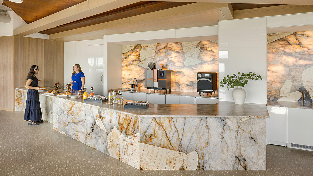 A couple of women in a kitchen.