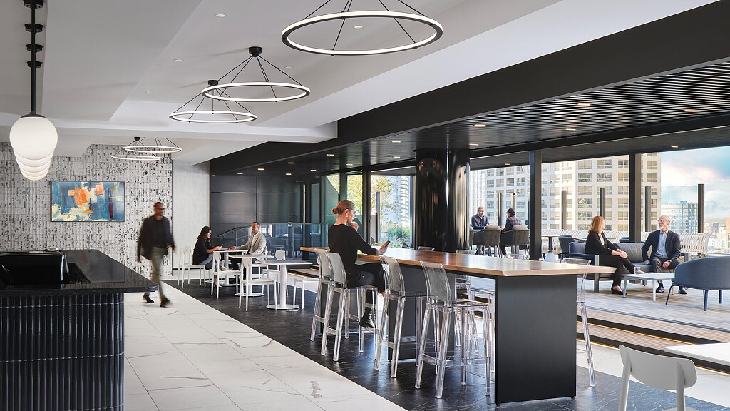 A group of people sitting at tables.